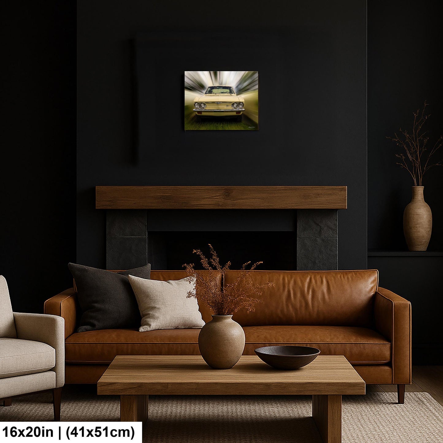 a living room with a brown leather sofa, a wooden coffee table, and a fireplace. Above the sofa, there is a framed picture of a car.