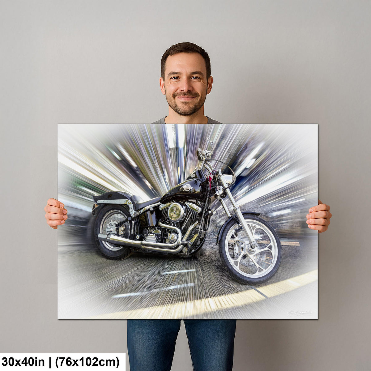 A man is holding a large canvas print of a motorcycle, which appears to be a digital artwork or collage.