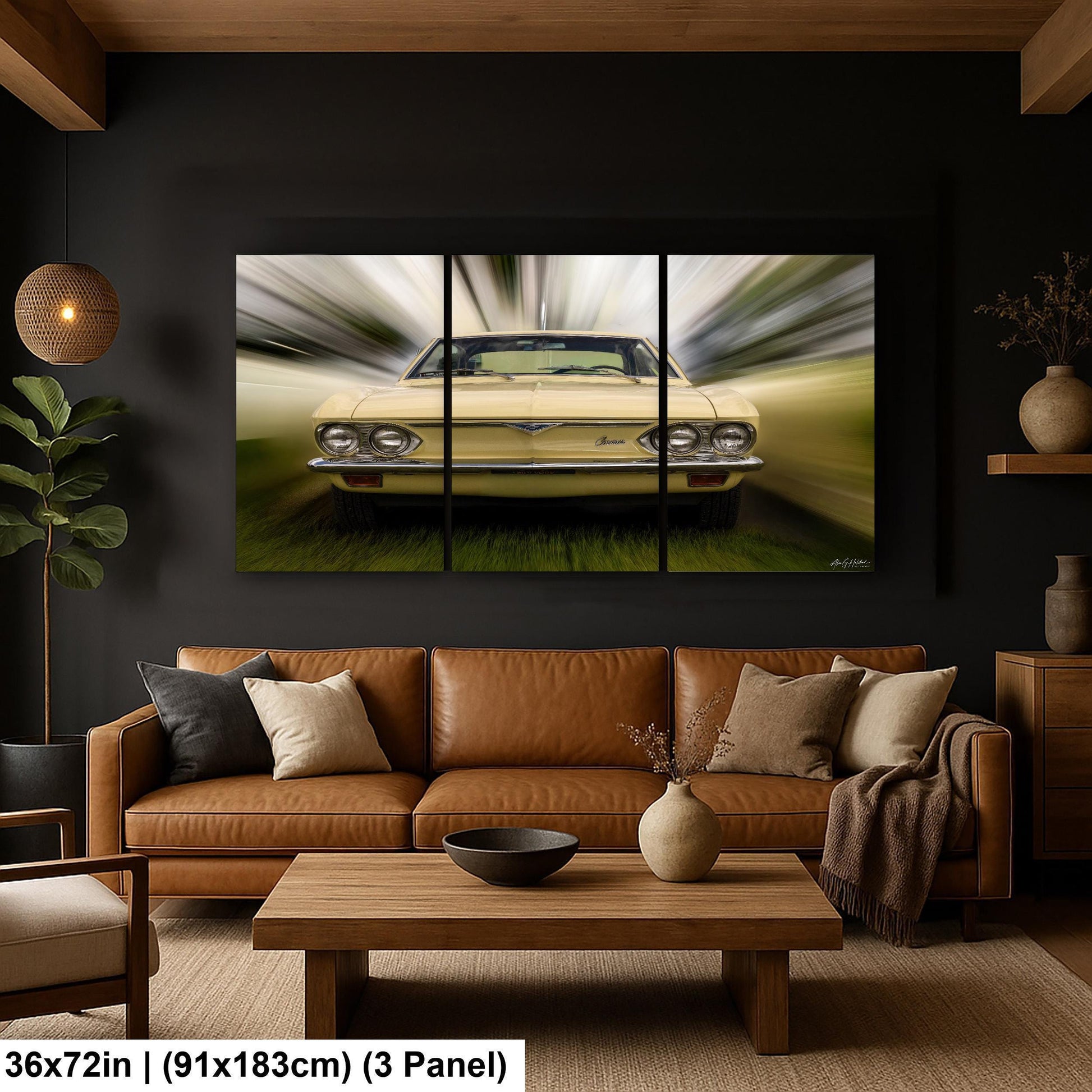 A modern living room with a large, three-panel painting of a yellow car in motion as the focal point. The painting is mounted on a dark wall above a brown leather couch, which is accompanied by a wooden coffee table. The room also includes a potted plant, a vase, and a bowl on the coffee table.