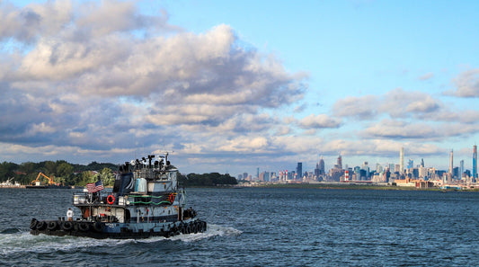 Manhattan skyline from Long Island Sound close to Hellgate canvas print metal print daylight tugboat