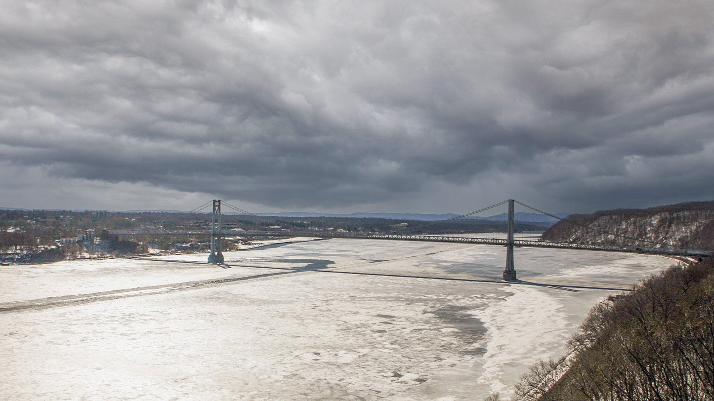 The Hudson River iced in at the Poughkeepsie Bridge with a storm approaching color poster canvas print metal print hudson valley photography