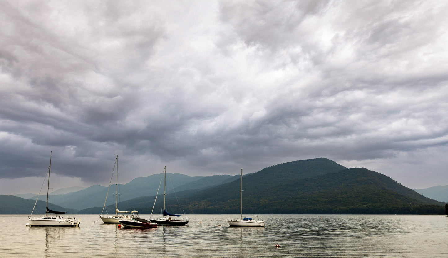 Lake george NY calm before the storm. Wall art canvas print metal print photograph boats water mountains clouds